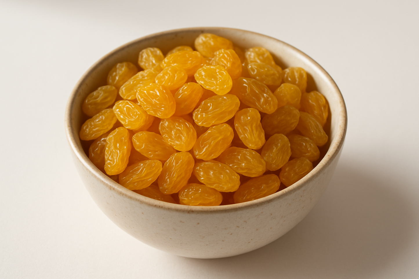 yellow dried grapes in a bowl